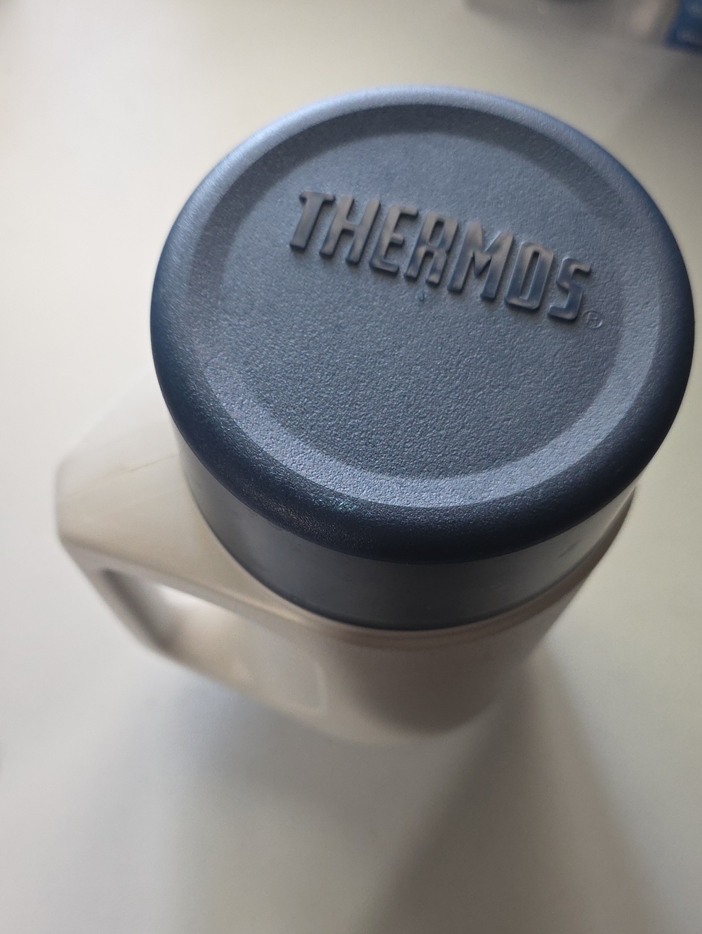 Thermos Travel Mug with Dark Blue Lid and Offwhite Body